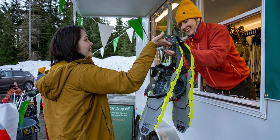 a person purchasing a snowshoe rental